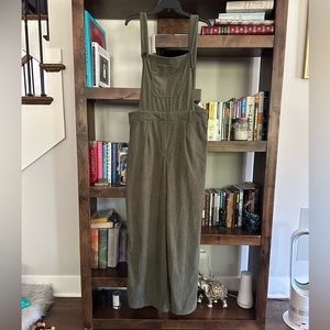 Cider overalls with an open back.